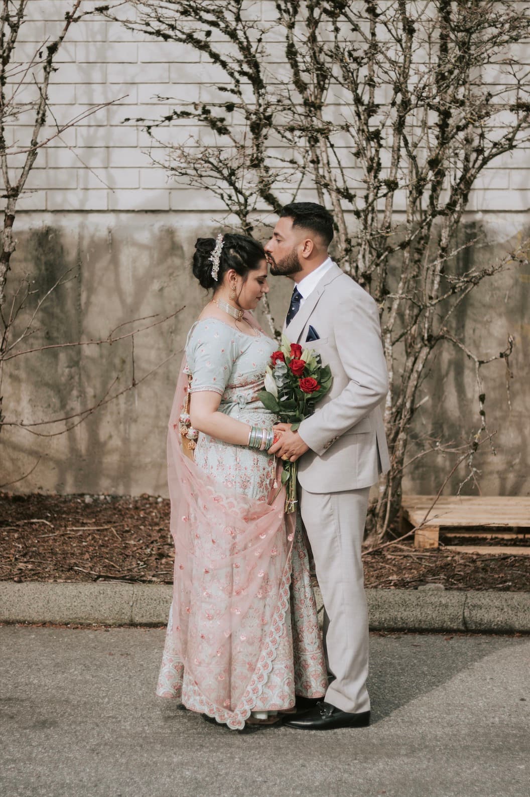 Bride and groom embracing on a mountain pass
