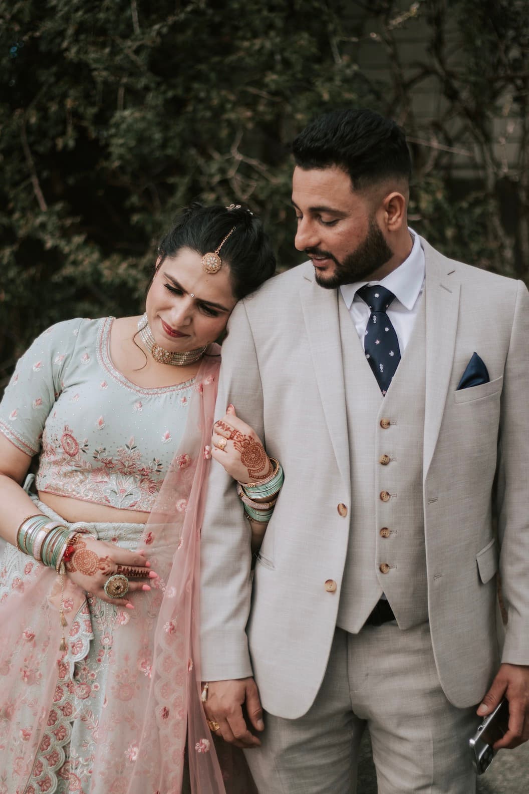 Newlyweds sharing a quiet moment outdoors